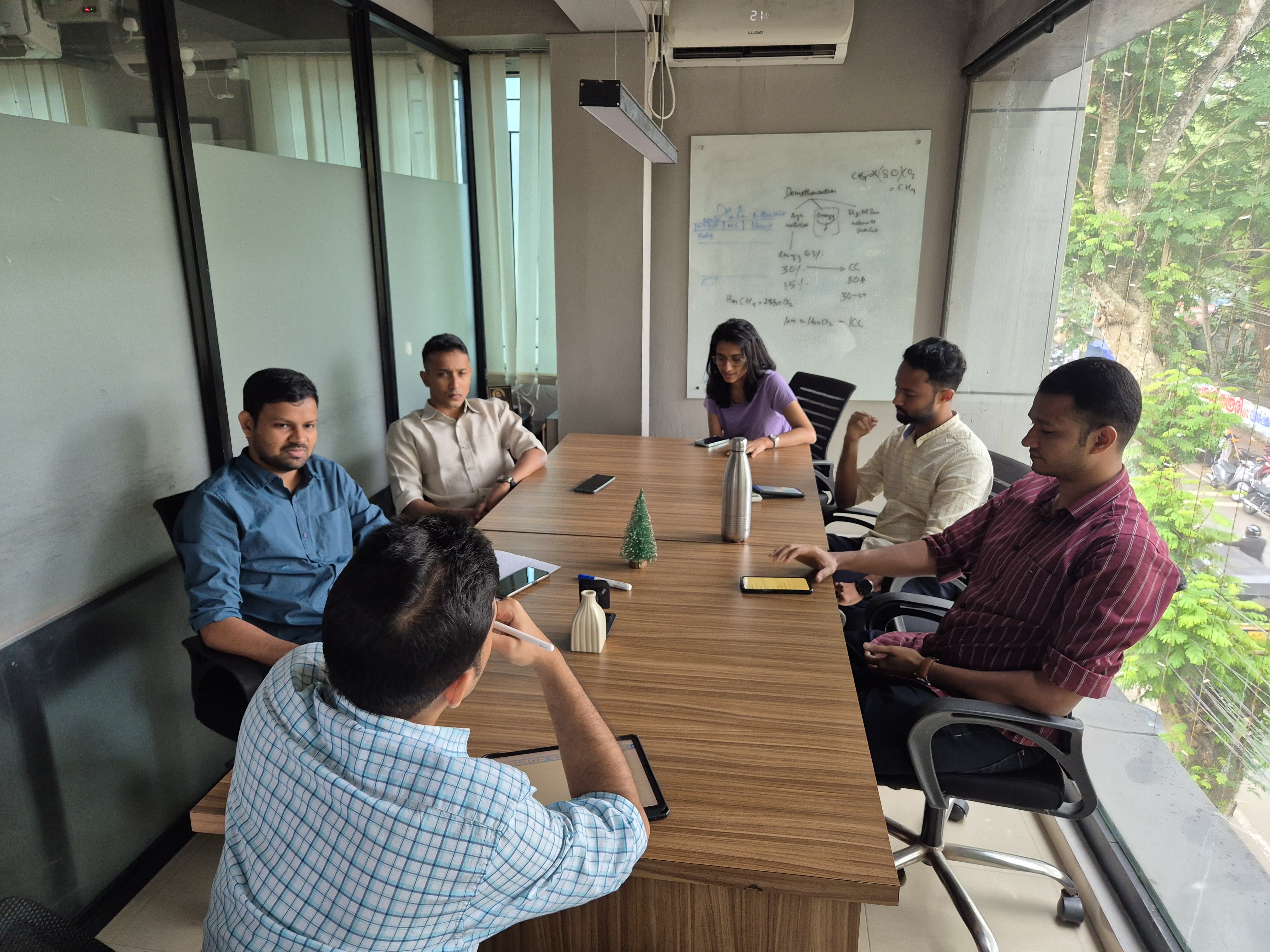 A mentor reviewing a student’s UPSC mock test answer sheet for personalized feedback