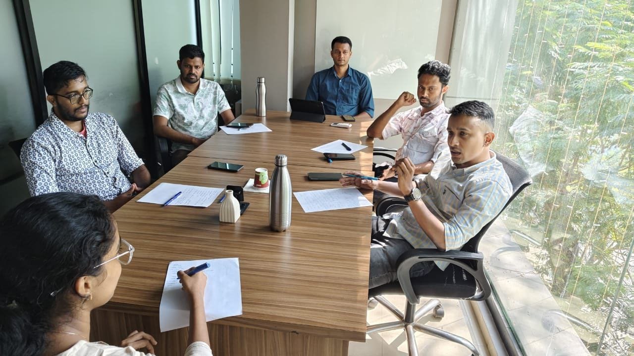 A mentor reviewing a student’s UPSC mock test answer sheet for personalized feedback